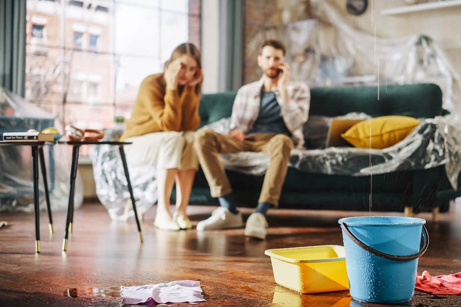 Stressed couple because of leaking roof