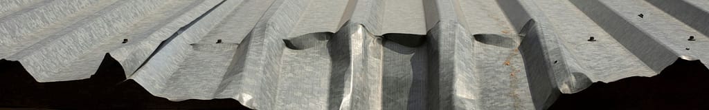 Bent metal roofing from hail damage