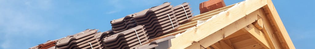 stacks of roofing material sitting on a roof