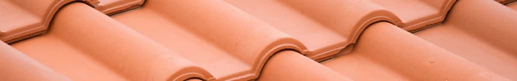 Clay barrel style roofing tiles