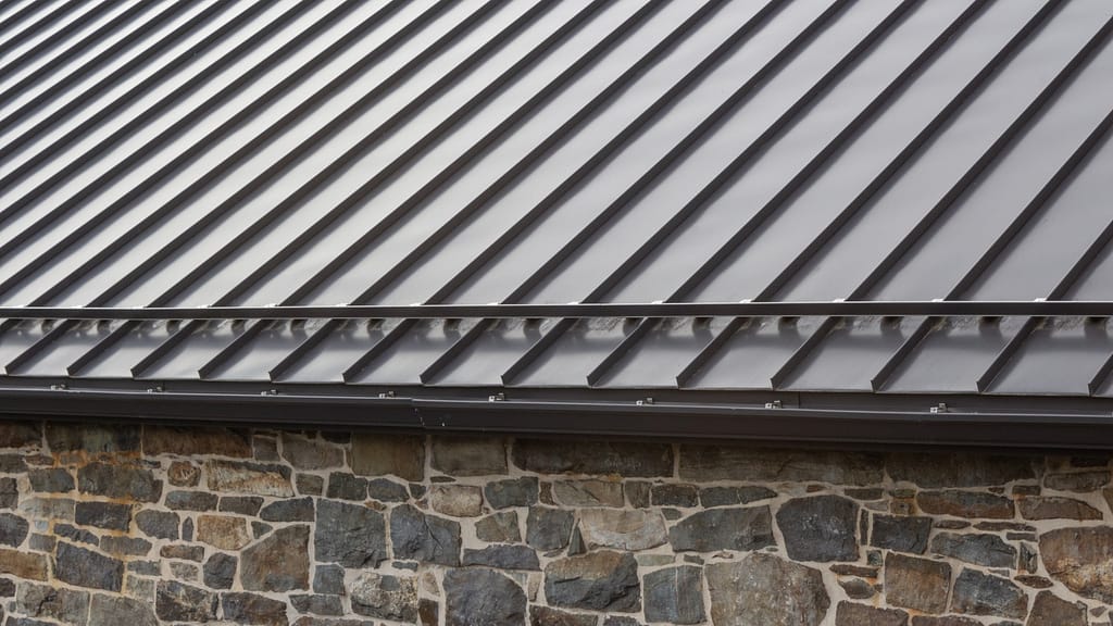 A standing seam roof with snow guards