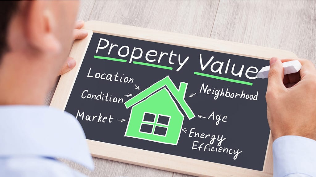 Person holding a diagram about property value