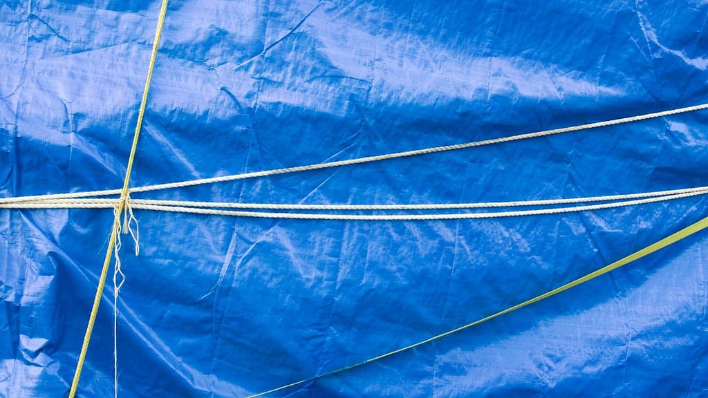 Blue vinyl tarp with rope