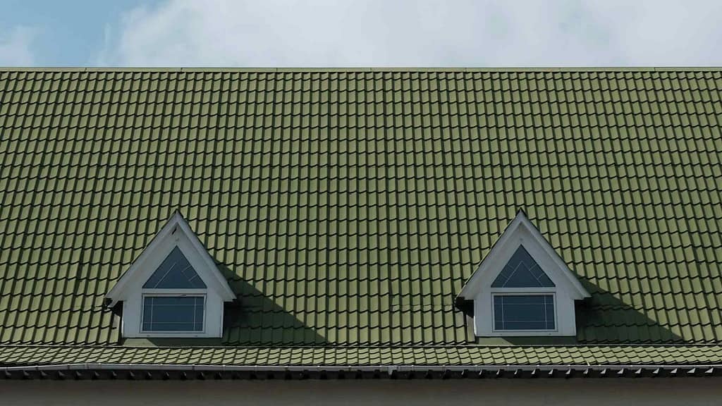 olive green roof with two windows installed by Arizona roofer