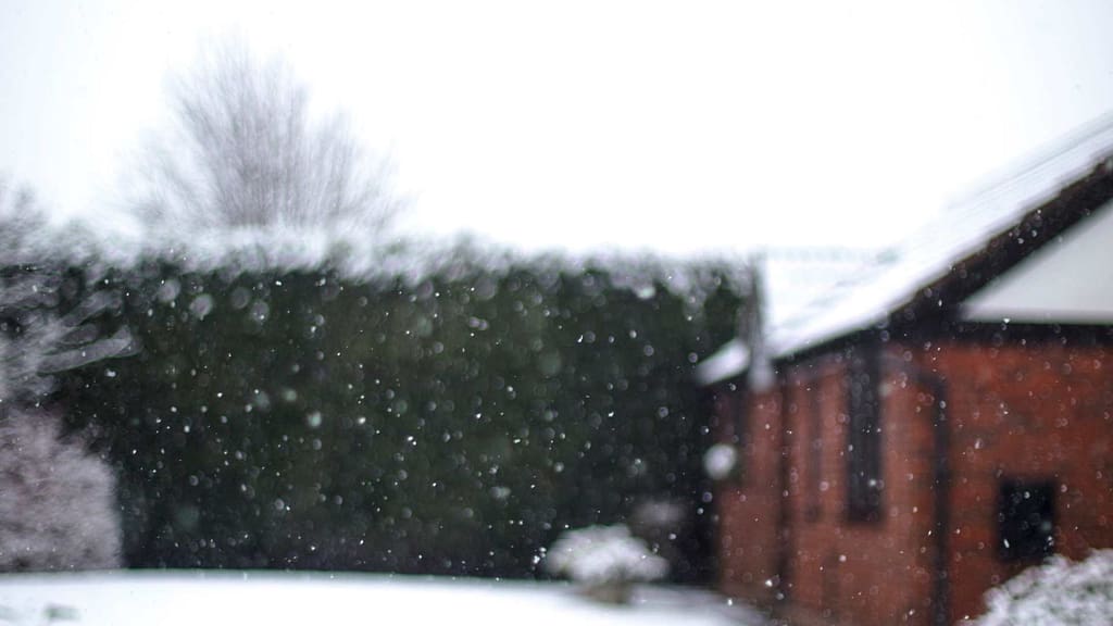 home roof with heavy snow inspected by Wisconsin roofer