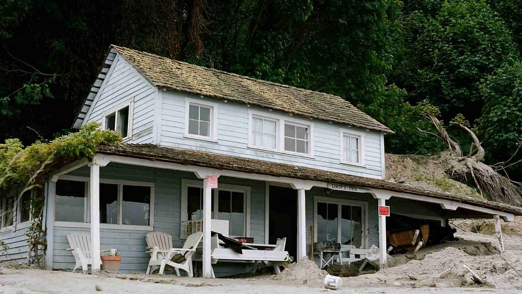 sand and old house by the beach