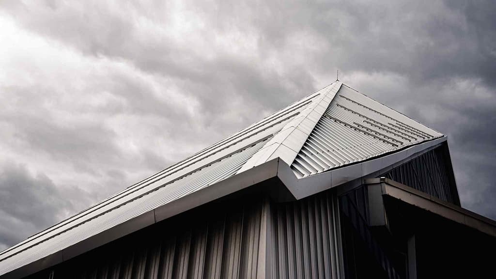 gray sky and metal roof from Vermont roofing contractor