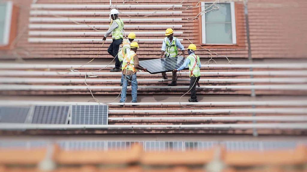 Connecticut roofer working on solar panels