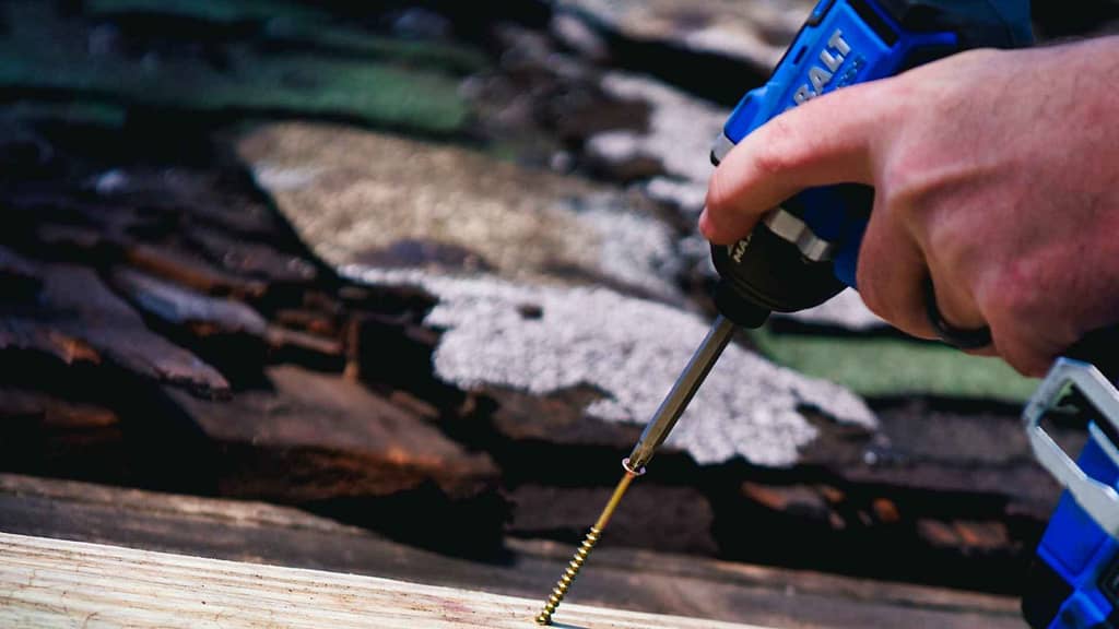 blue hand drill tool from Oregon roofing contractor