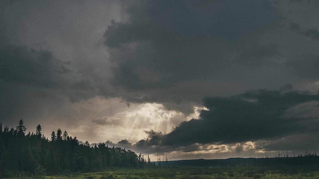 dark sky about to rain affects labor of 
 your Arkansas roofing contractor 