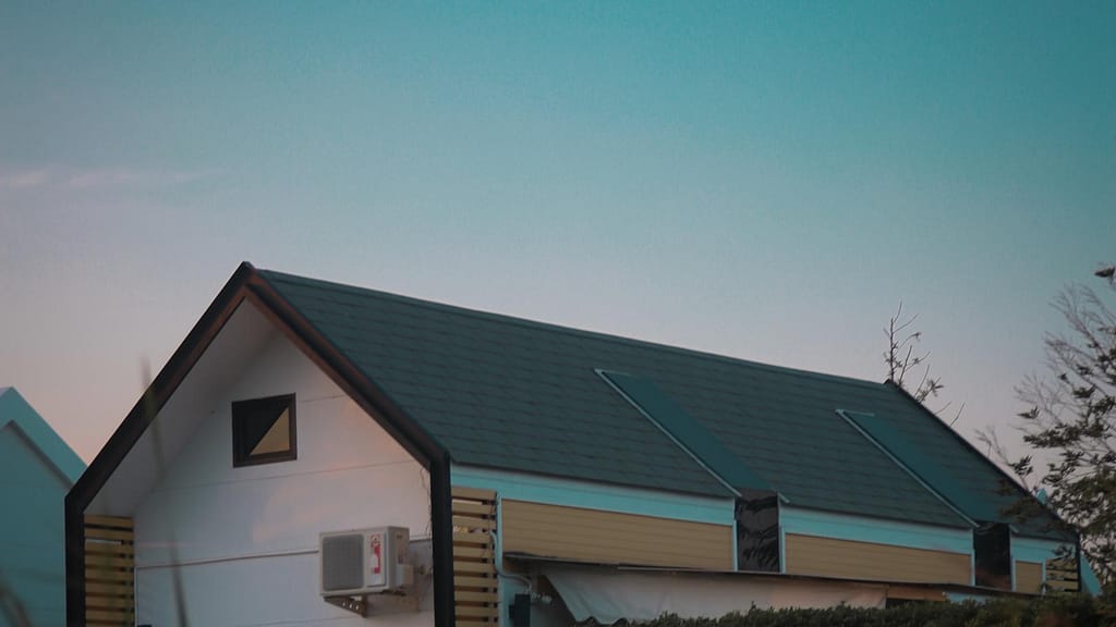 white home with gray roof from Nevada roofing contractor