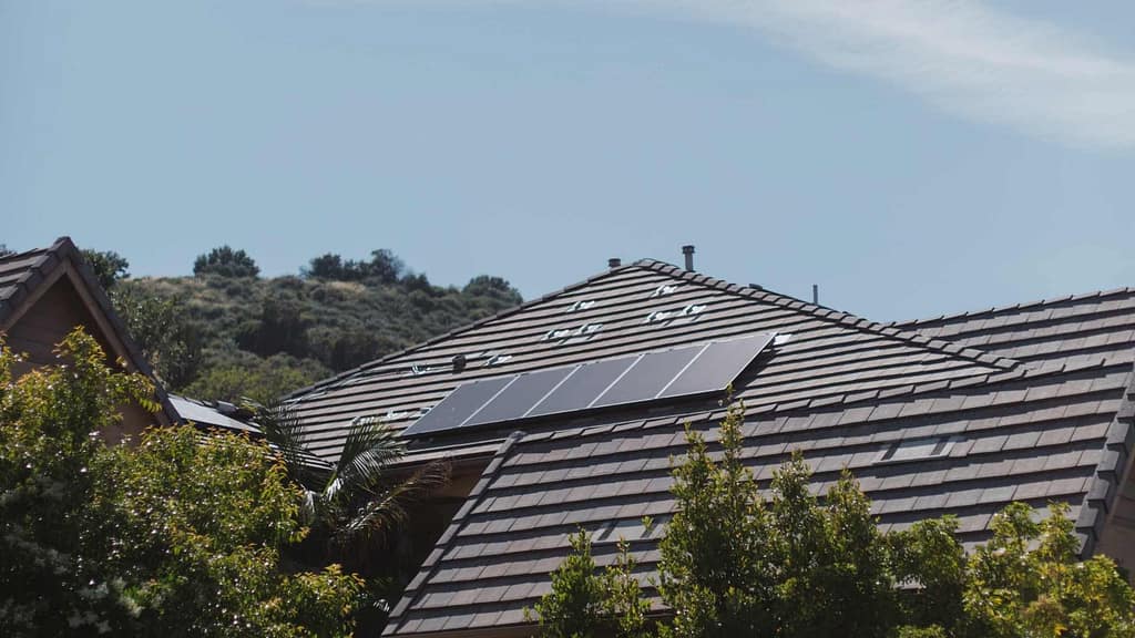 home roof with solar panel installed by New Mexico roofer