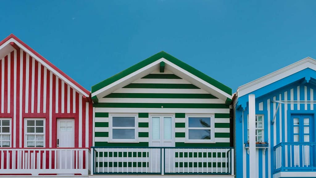 a row of red green and blue house scanned by South Carolina roofing calculator