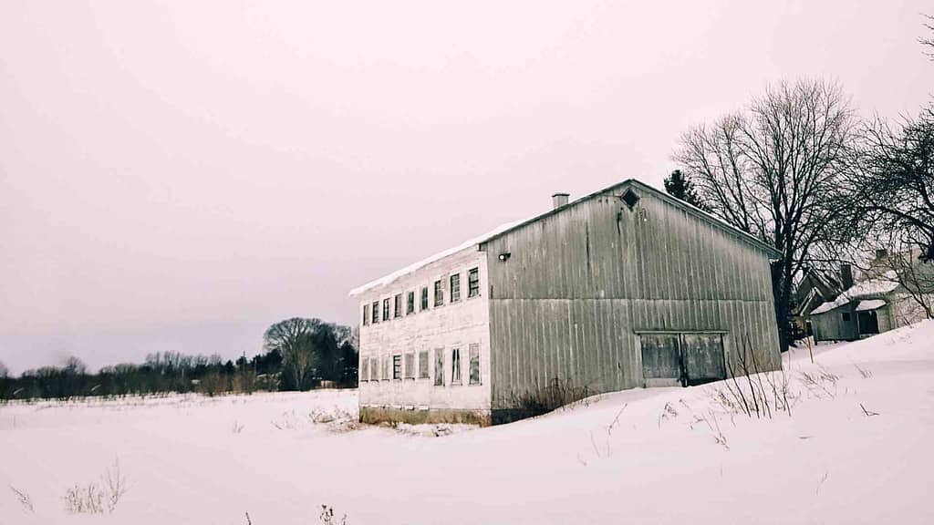 Idaho roofing contractor to inspect this white home covered with snow