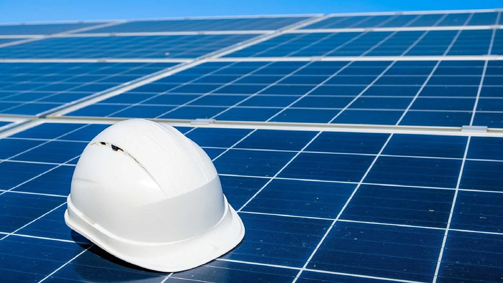 solar panel and a white hard hat