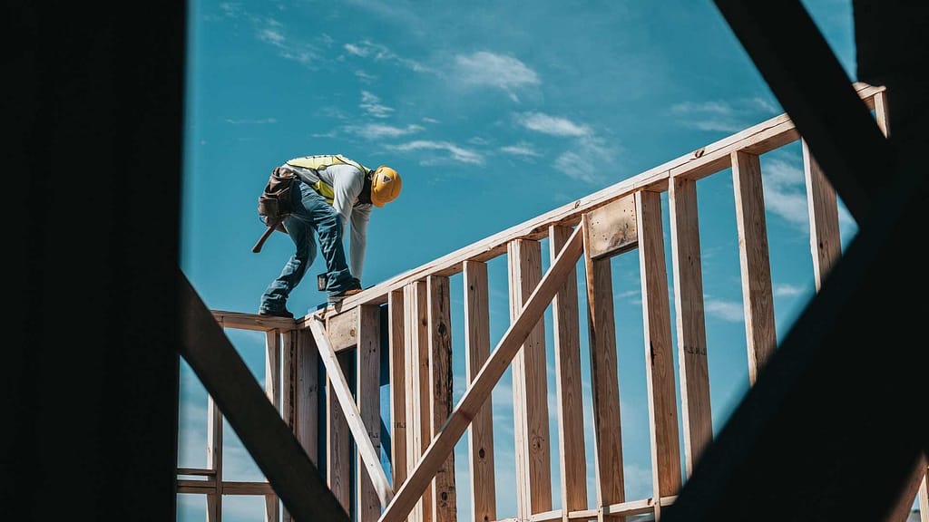 a skilled New Mexico roofer wears PPE