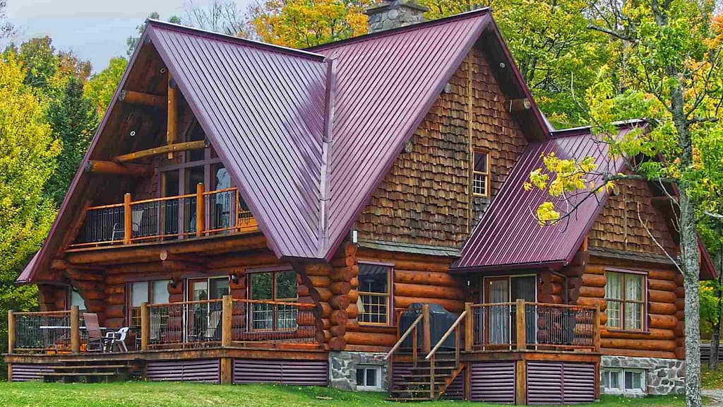 wood house with purple metal roof scanned via North Carolina roofing calculator