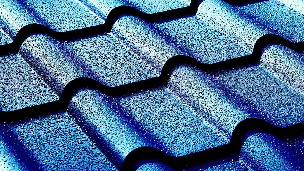 blue metal roof with drops of water