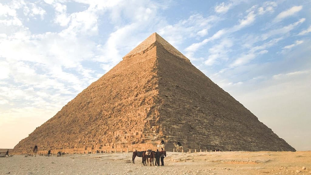Pyramid with people and animals out front