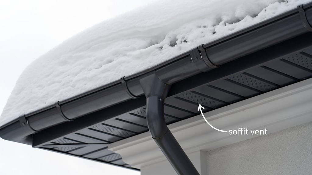 Soffit vent on a roof covered in snow