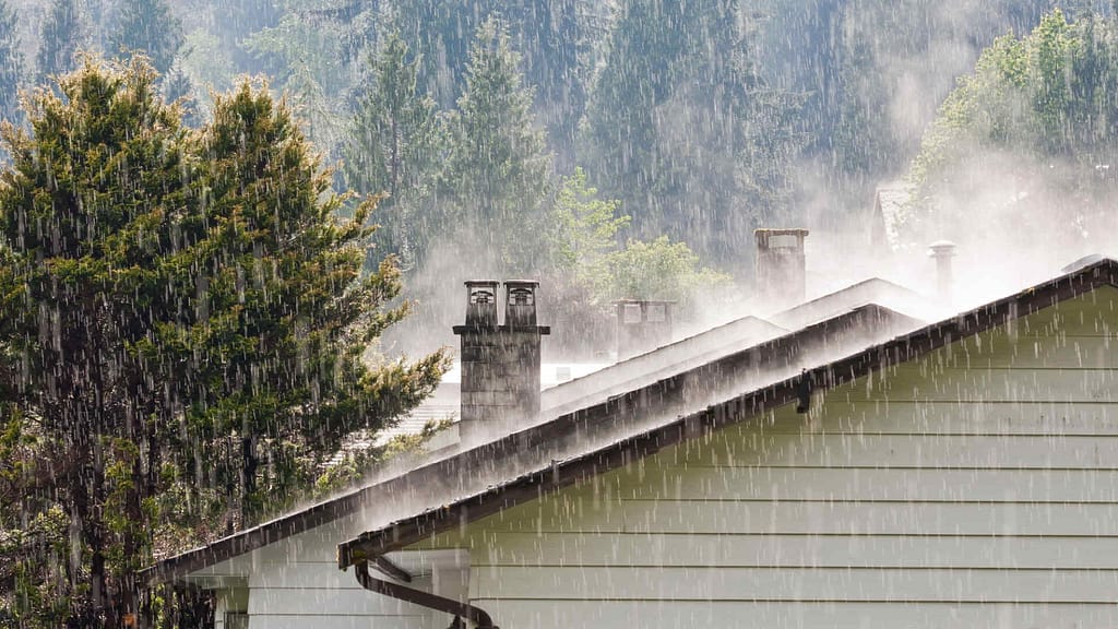 heavy rain on a house with gable roof