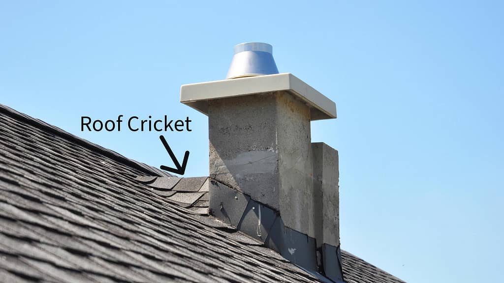 a roof cricket on the high side of a chimney