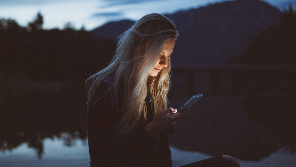 Person using phone to look up roofing prices in Maryland via Instant Roofer