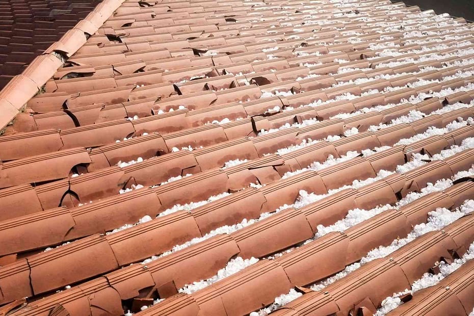 Hail damaged clay tiles on a roof