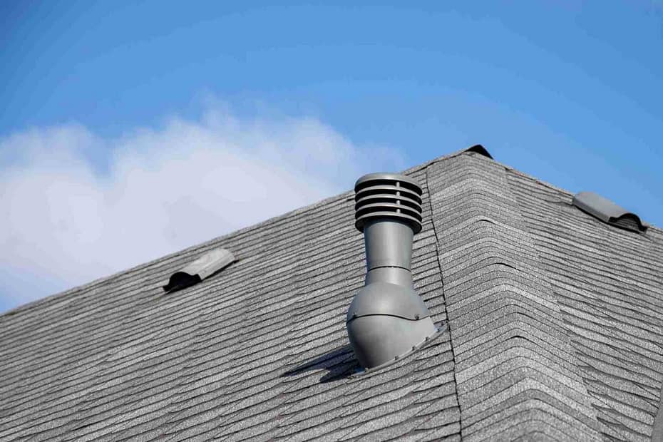 chimney roof vent sitting on an asphalt roof