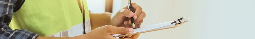 Roof inspector holding a clipboard