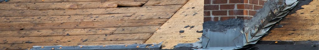 asphalt roof tore off being prepared for roof replacement