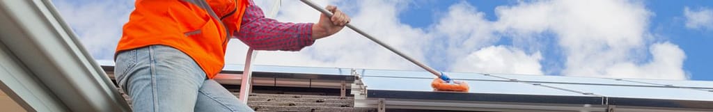 contractor cleaning solar panels
