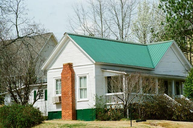 Image of a house with standing seam metal roofing.
