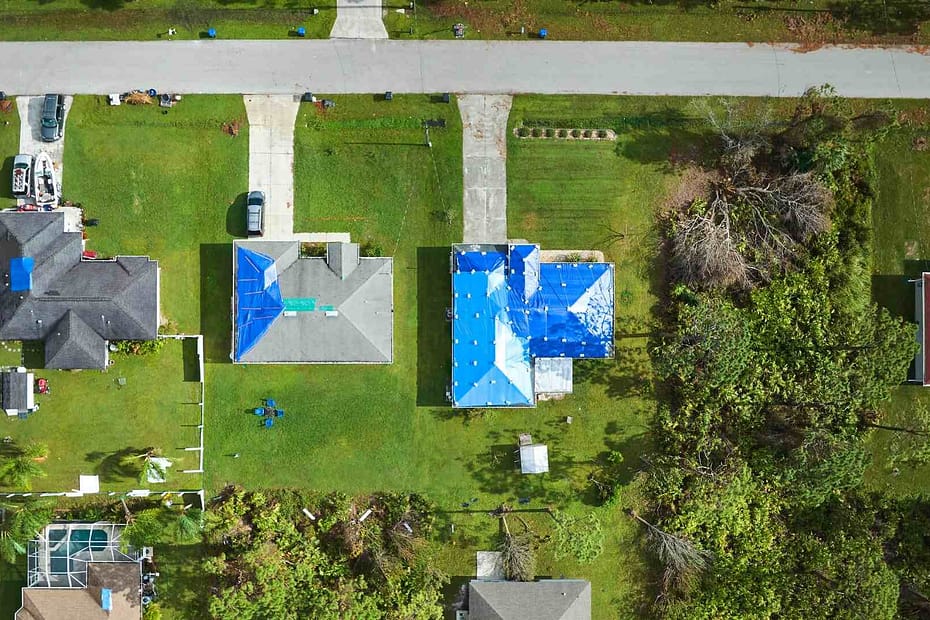 Homes with tarp after storm