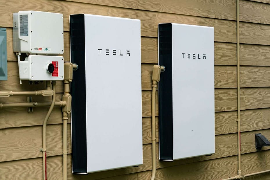 tesla powerwall affixed to side of house