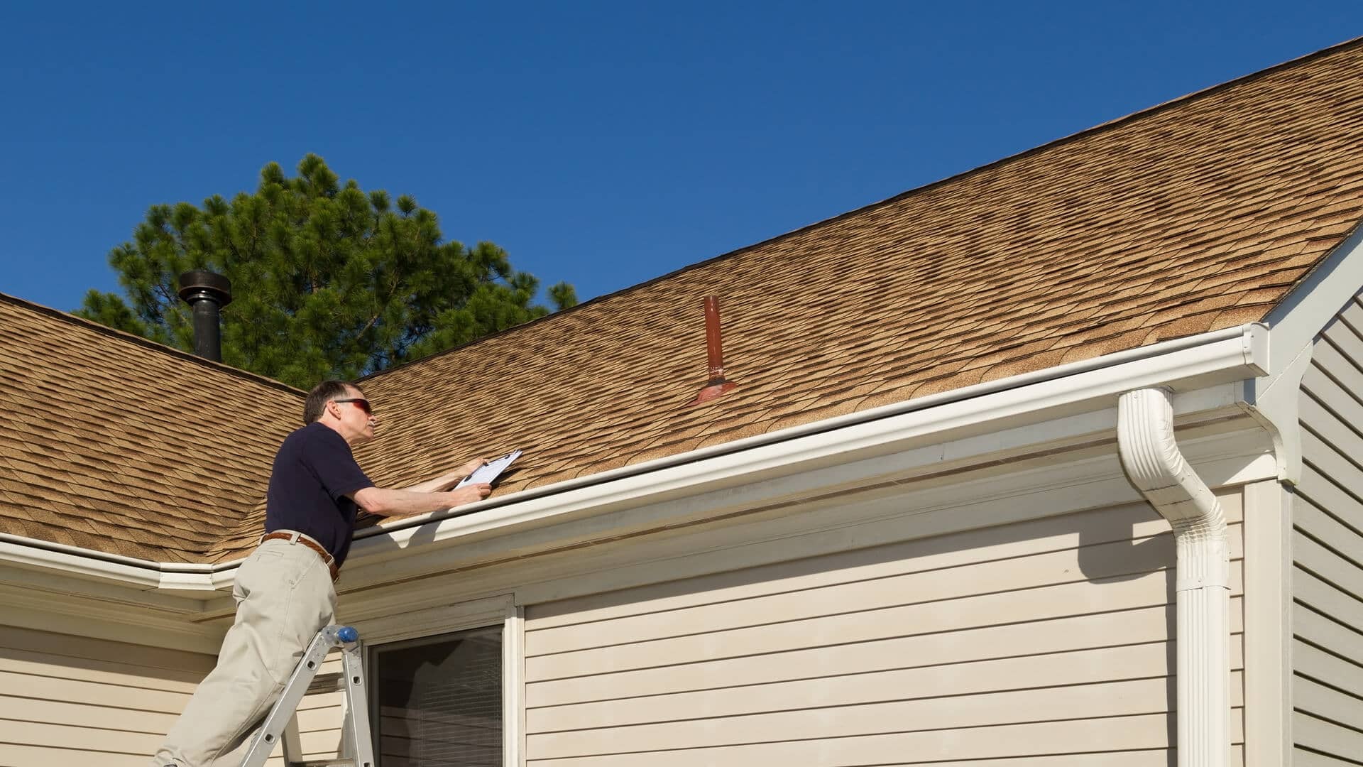 A man doing a roof inspection