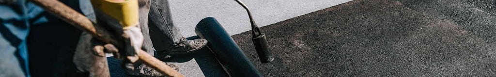 flat roof insulation being installed with blow torch