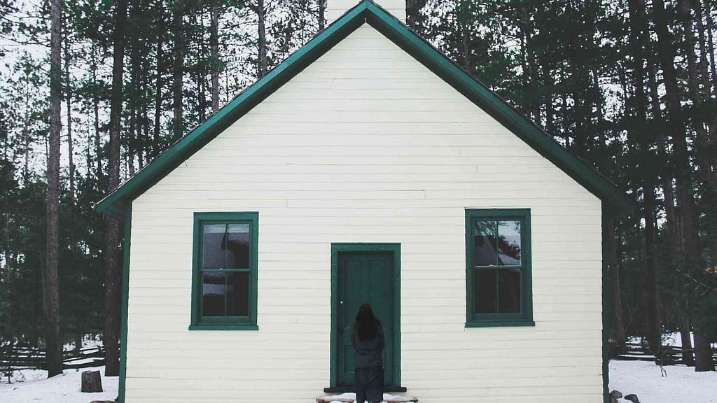 Front Gable Roof on a simple white home with snow.