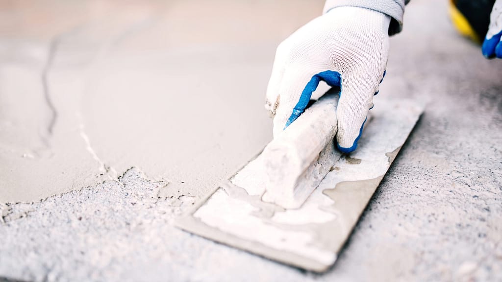 Person applying roofing cement