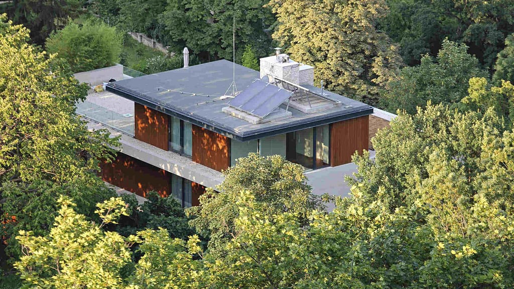 house with flat roof with trees around it