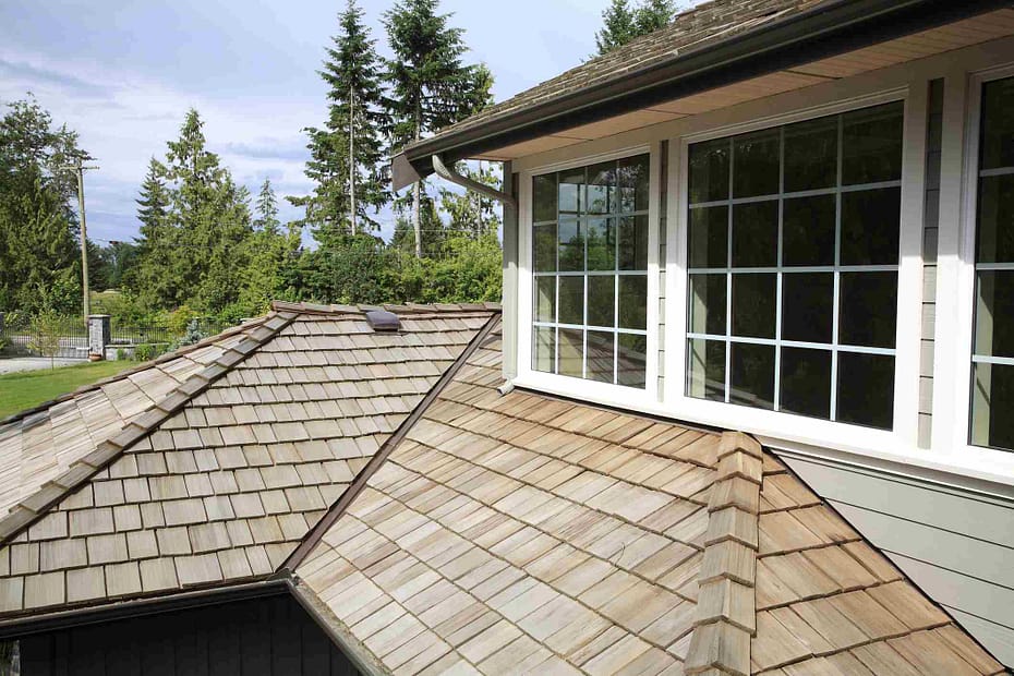 view of cedar roof with large windows
