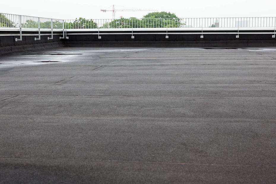 flat roof with light pooling after a storm