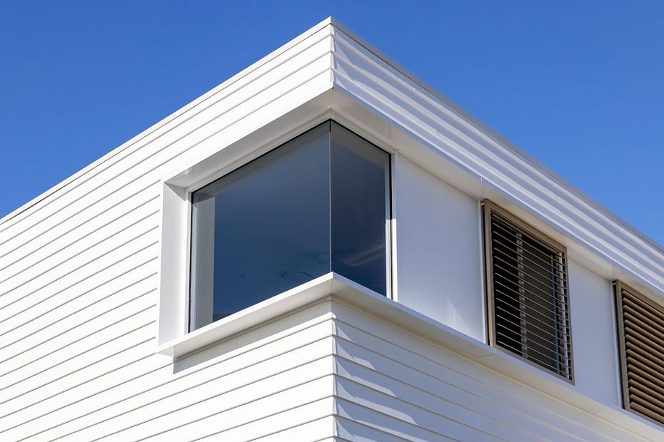 photograph and a modern styled house with a flat roof